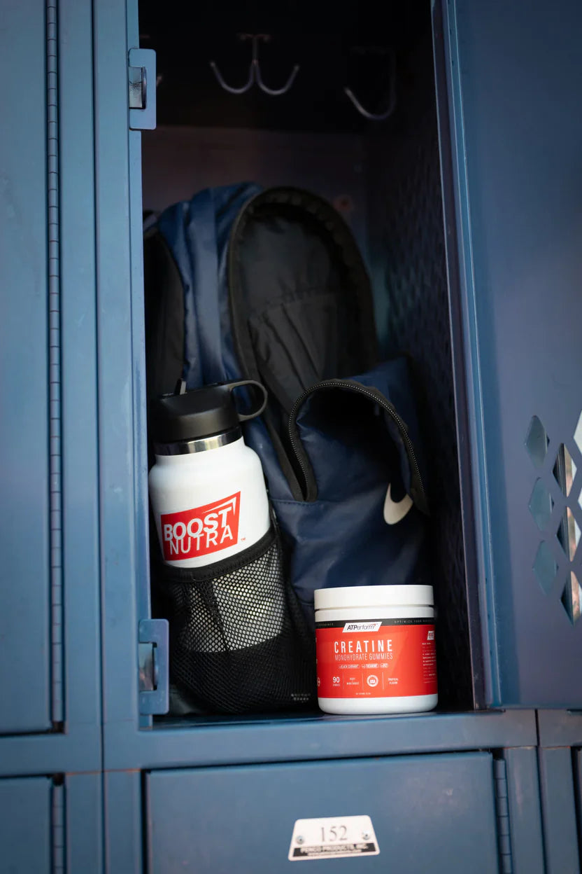 Boost Nutra ATPerform Creatine Monohydrate gummies  in gym locker room
